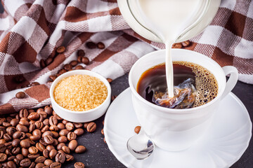 cup of fragrant fresh coffee on a dark stone background