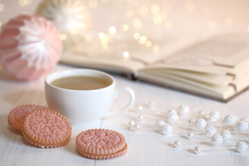 Book, ball, cookies, cup with cocoa and marshmallows.