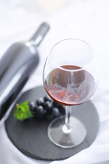 Glass with grape red semi-dry wine. Valentine's day concept background. Gift for the holiday. Sweet sparkling wine.