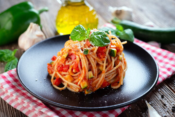 Spaghetti with eggplant, zucchini, paprika and tomato sauce