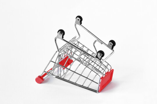 Empty inverted shopping cart on white background - Concept of shopping cart abandonment