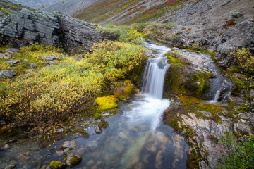 Naklejka na ściany i meble Waterfall in the mountains