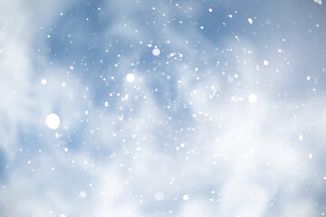 Fototapeta na wymiar blue snowfall bokeh background, abstract snowflake background on blurred abstract blue