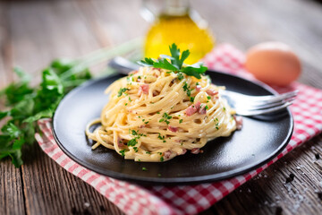 Spaghetti alla carbonara. Pasta with pancetta, egg, parmesan cheese and cream sauce. 
