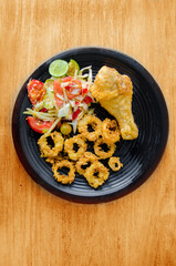 papaya salad with fried chicken and squid