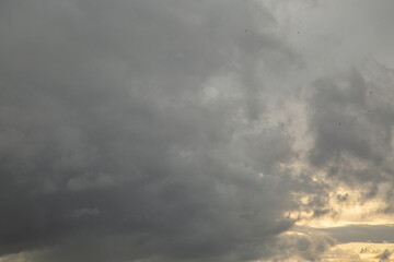 Sunset sky with clouds and orange and blue tones