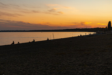 Naklejka na ściany i meble Bright landscape with sunset on the beach.
