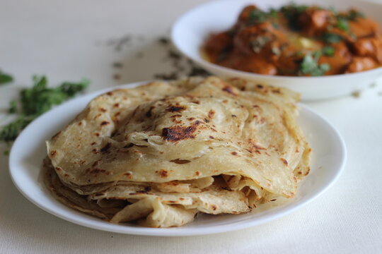 Homemade Malabar parotta with butter chicken