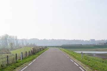 Road on a dyke in polder landscape