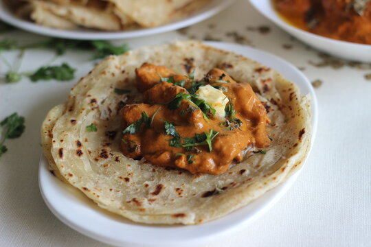 Homemade Malabar parotta with butter chicken