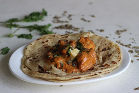 Homemade Malabar parotta with butter chicken