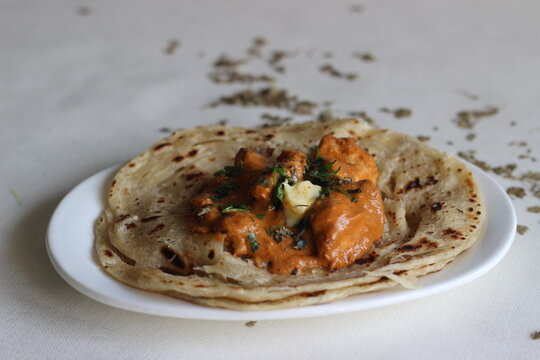 Homemade Malabar parotta with butter chicken