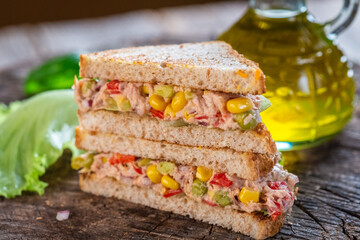 Healthy tuna sandwich with tomato, corn and onion 