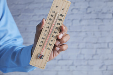  hand holding Temperature measurement tools with copy space 