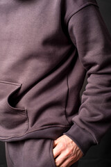 parts of hoodie clothing on men on a colored background