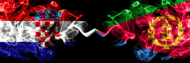 Croatia, Croatian vs Eritrea, Eritrean smoky mystic flags placed side by side. Thick colored silky abstract smoke flags.