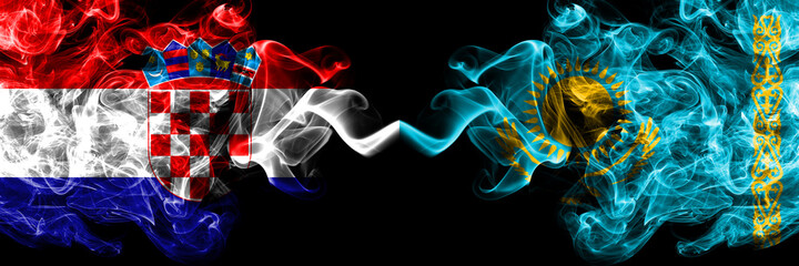 Croatia, Croatian vs Kazakhstan, Kazakhstani smoky mystic flags placed side by side. Thick colored silky abstract smoke flags.
