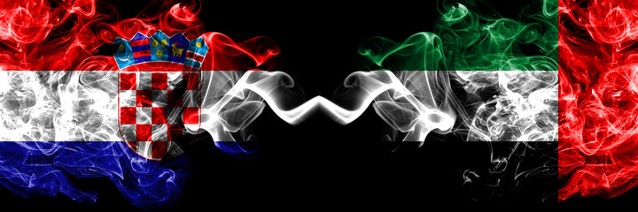 Croatia, Croatian vs United Arab Emirates, Emirati smoky mystic flags placed side by side. Thick colored silky abstract smoke flags.