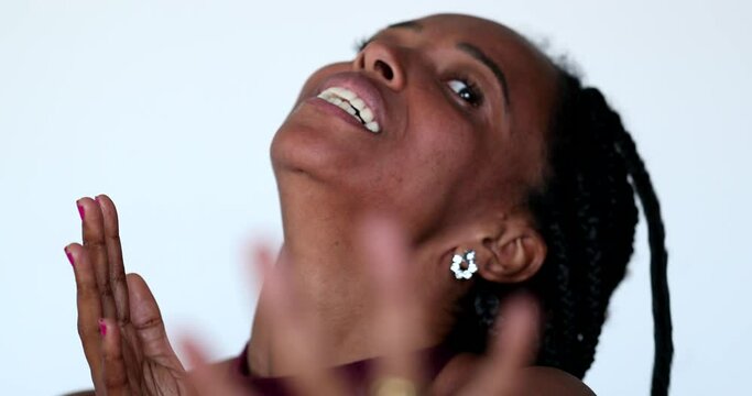 Anxious black African woman reacting to HORRIBLE news with HORROR and SHOCK. Desperate person screaming