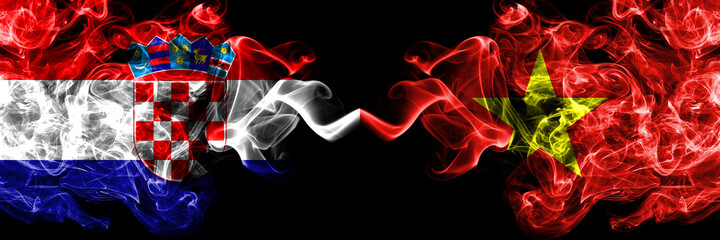 Croatia, Croatian vs Vietnam smoky mystic flags placed side by side. Thick colored silky abstract smoke flags.