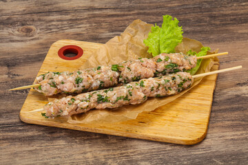Raw minced pork skewer kebab for grill