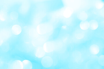 Bokeh light on blue background, sky with circle glitter light blue. Snow abstract soft glowing with vivid bright light and bokeh blur effect. 