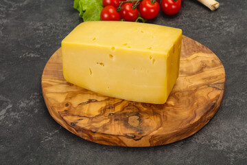 Hard yellow tasty cheese brick