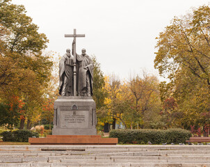 Moscow, Russia, Oct 9, 2020:  Slavyanska square. Autumn trees. Monument to Saints Cyril and...