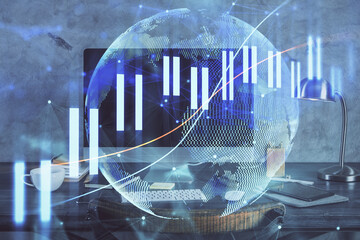 Double exposure of chart and financial info and work space with computer background. Concept of international online trading.