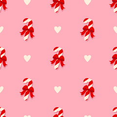 Christmas sugar striped candy with red holiday bow seamless pattern. Pattern with lollipops and hearts on a pink background. Seamless pattern for gift wrapping, gifts, stationery, invitations, banners