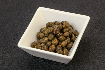 Tasty capers in the bowl