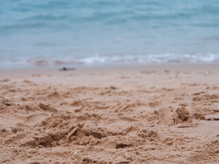 Fototapeta na wymiar Evening beach sand and blurred background