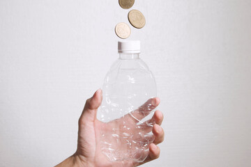 Plastic Bottle make Money. Recycle plastic bottle to money. Concept for recycle and make money with...