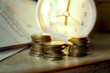 Long term investment, Clock with coins. Idea for Retirement fund, Investing plan, Business growth and Passive income