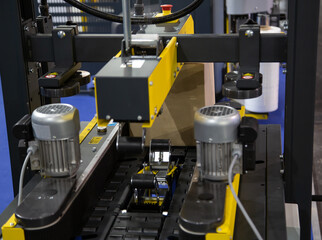 Process of carton forming machine in production line. Warehouse logistics technology