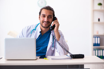 Young male doctor in telemedicine concept