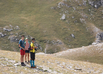 two brothers and a young sister in the mountains