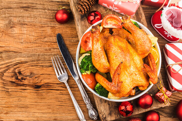 Roasted whole chicken with Christmas decoration.