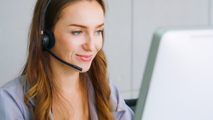 Business people wearing headset working in office to support remote customer or colleague. Call center, telemarketing, customer support agent provide service on telephone video conference call.