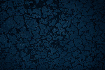 Dark blue textured wall.