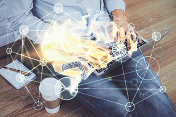 Businessman with computer background with brain theme hologram. Concept of brainstorm. Multi exposure.