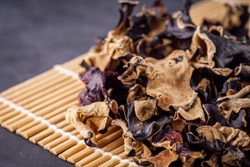 delicious asian black fungus mushroom on a dark stone background