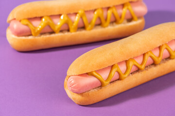 Close-up on fresh hotdogs with mustard