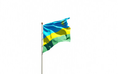 National state flag of Rwanda fluttering at sky background.