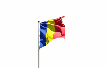 National state flag of Romania fluttering at sky background.
