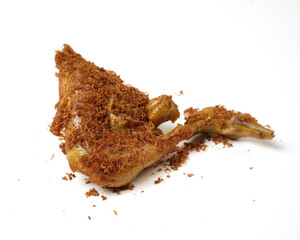 Indonesian spices fried chicken, isolated white background. a portrait of fried chicken thigh and chicken breast.
