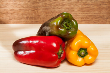 Capsicum annuum - Healthy food; three colored sweet peppers: red, yellow, and green.