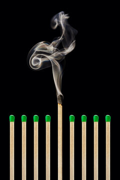 One extinguished match in a group of green matches, emotional burnout, stress, work-life balance