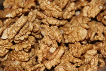 A scattering of walnuts. Crop of nuts. Background