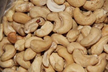 A scattering of cashew nuts. Crop of nuts. Background